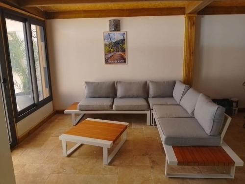 a living room with a couch and a coffee table at Villa de l'Océan in Saint-Pierre