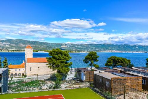 a view of a church and a body of water at Apartments Villa Niko in Trogir