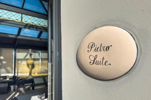 a sign on a door with the words pitcher at Maison boutique At Pietro in San Pietro in Lama