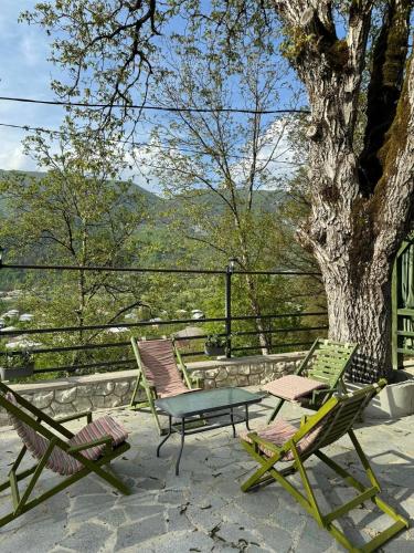 a group of chairs and a table on a patio at View Racha in Ambrolauri