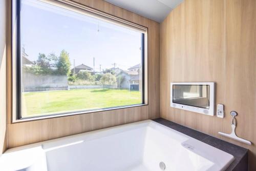 Llit o llits en una habitació de KARAKUSA Villa