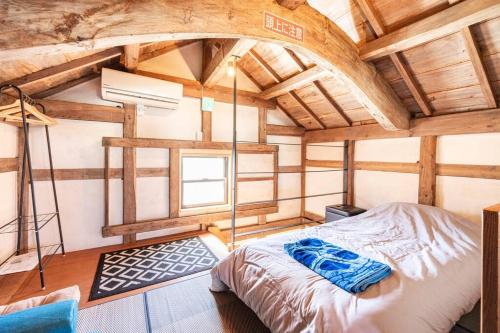 Llit o llits en una habitació de KARAKUSA Villa