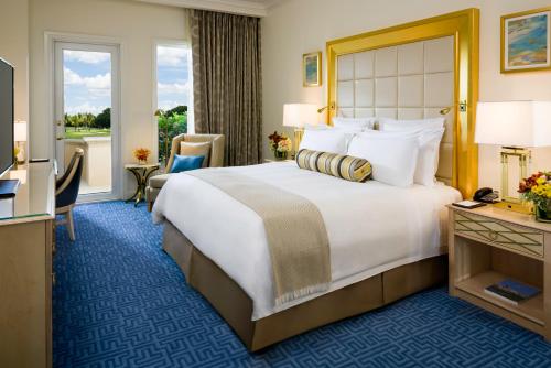A bed or beds in a room at Trump National Doral Golf Resort