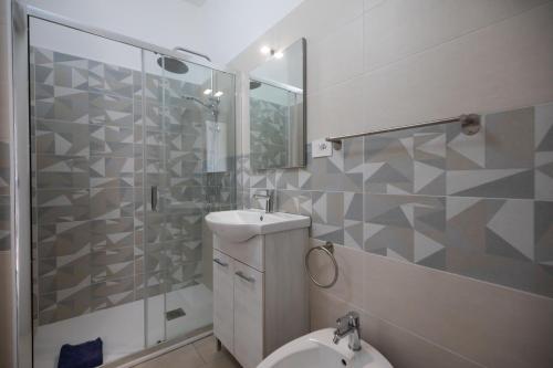 a bathroom with a toilet and a shower and a sink at Villaggio Camping Fiorina in Capo Vaticano