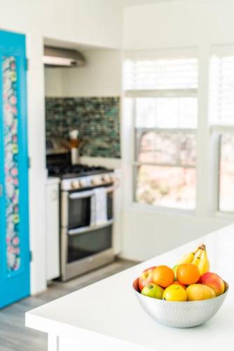 a bowl of fruit on a counter in a kitchen at Artsy Half-House, Walk to Hiking Trails &Wine Bars! Yard, Firepit in Sedona