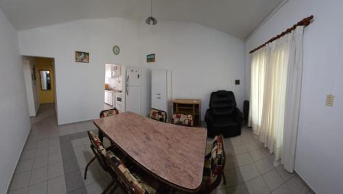 a dining room with a table and chairs at Apart More in Villa Mercedes