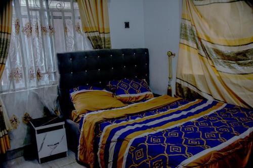 Ένα ή περισσότερα κρεβάτια σε δωμάτιο στο AOSL Homes