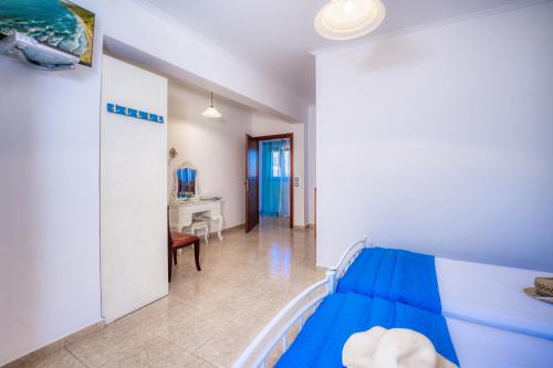 a bedroom with a bed and a desk at Sea View Villa Paramonas in Paramonas