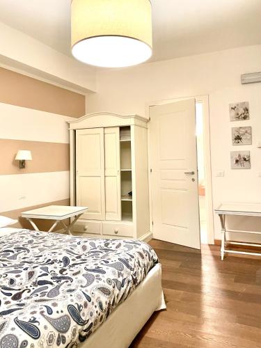 a bedroom with a bed and a table and a piano at Residenza Cantore in Verona