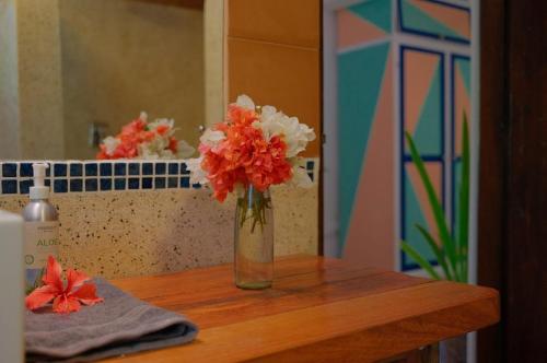a vase of flowers sitting on a table at Salty's Kitesurf Village in Kilifi