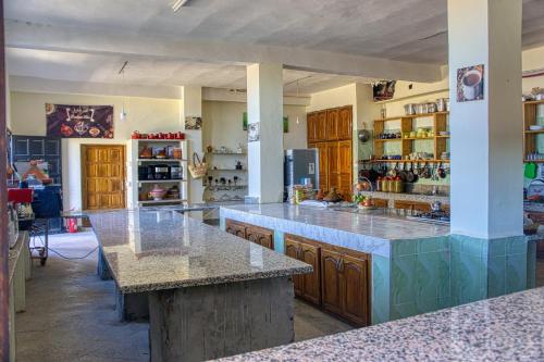 a large kitchen with marble counter tops and cabinets at lmtounipalace in Ouarzazate