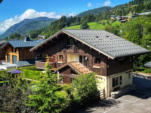 an aerial view of a house with a roof at Chalet Aventure B&B Les Gets in Les Gets
