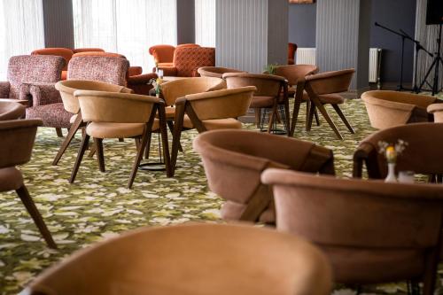 a row of chairs and tables in a room at Hierapark Thermal & SPA Hotel in Pamukkale