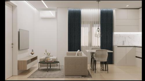 a living room with a chair and a table at Tris Apartments Tirana in Tirana