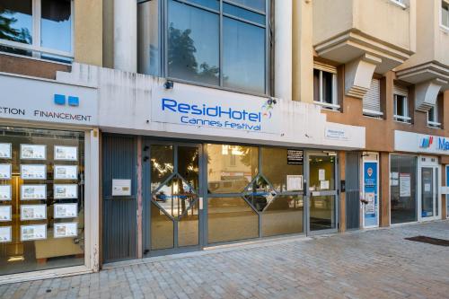 a store front of a building with glass doors at Residhotel Cannes Festival in Cannes