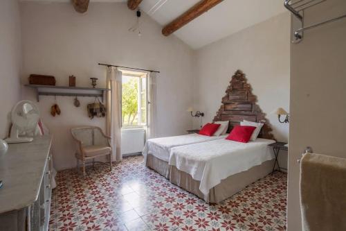 a bedroom with a bed and a christmas tree at Les Beaumettes, villa provençale à deux pas de Gordes in Beaumettes