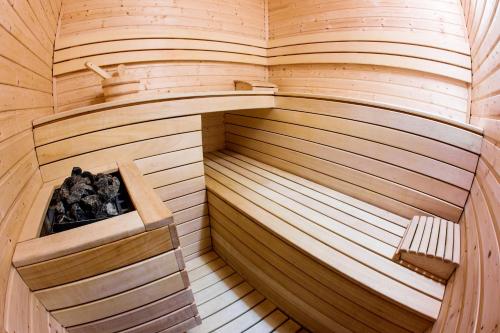 an inside of a sauna with a bench in it at Przystań Leśniów in Żarki