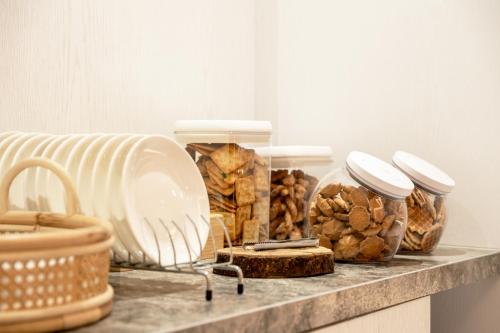 a shelf with jars of food and bread on it at suye hotel in Taichung