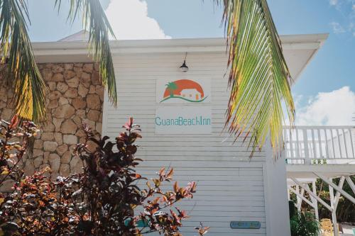 a sign on the side of a building at Guana Beach Inn in Great Guana Cay