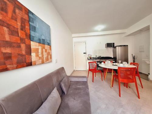 a living room with a couch and a table at LK Centro 2 in Belo Horizonte