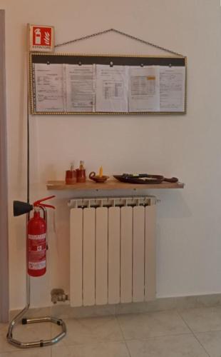 a room with a fire extinguisher on a wall at Narniandum Est in Narni