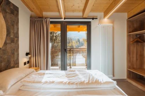 Postel nebo postele na pokoji v ubytování Residence Piz Aot