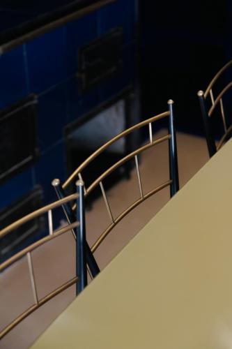 a stair railing in front of a fireplace at Fiermonte Museum by La Fiermontina in Lecce