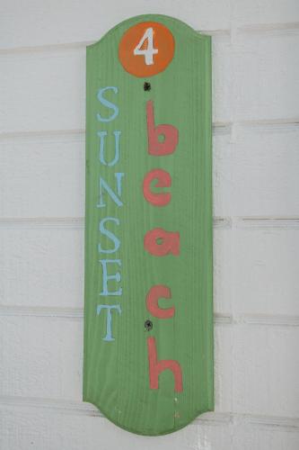 a sign on the side of a building at Guana Beach Inn in Great Guana Cay