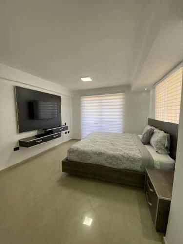 Ένα ή περισσότερα κρεβάτια σε δωμάτιο στο Apartamento Vacacional - Vista al Mar - Petalo 1 Piso 1