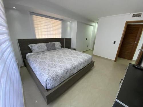 Ένα ή περισσότερα κρεβάτια σε δωμάτιο στο Apartamento Vacacional - Vista al Mar - Petalo 1 Piso 1