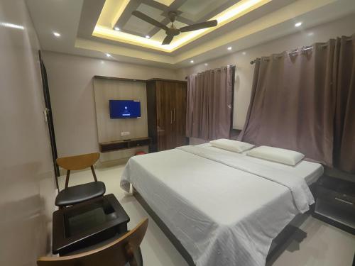 Un televizor și/sau centru de divertisment la SR Hotel