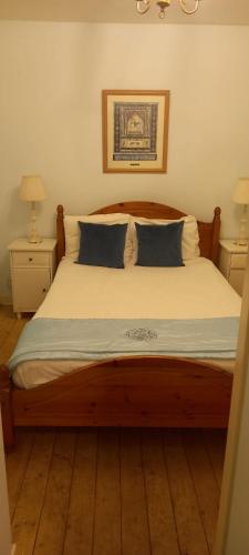 a bedroom with a large bed with two night stands at Newhall in Glasgow