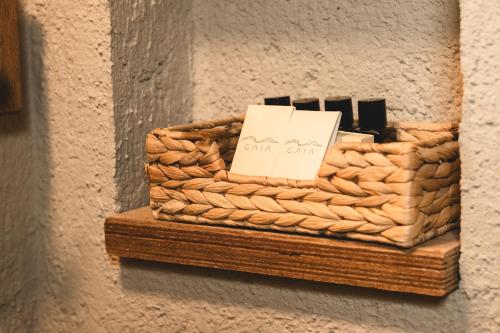 a basket on a wall with a sign on it at GAIA Alaçatı Bazaar in Alacati