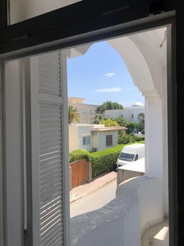 an open window with a view of a street at Dar Sammoud A1 in Kelibia