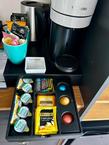 a black box filled with different types of snacks at Hotel No5, Beachfront with Free Private Car Park in Llandudno