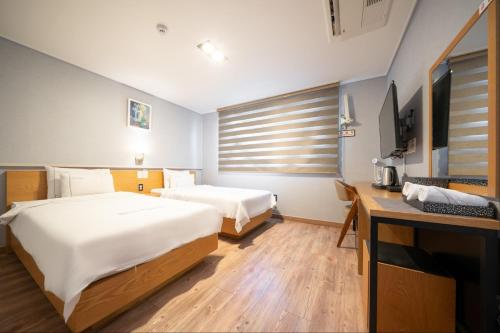 Postel nebo postele na pokoji v ubytování Sea Star Hostel