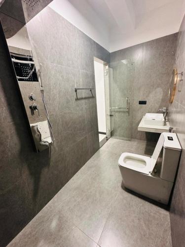 a bathroom with a toilet and a sink at Kyali Homestay Tangalle in Tangalle