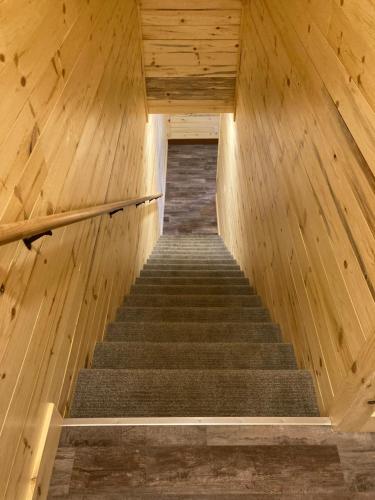 a set of stairs in a wooden building at Keweenaw Waters Resort in Houghton