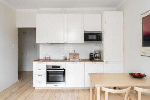 Kuchyň nebo kuchyňský kout v ubytování Apartment in Kamppi