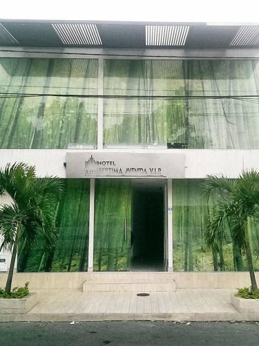 a building with a sign on the front of it at Hotel Septima Avenida in Neiva