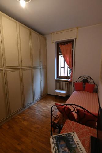 an empty room with a bed and a window at Villa Francesca B&B in Grumello del Monte