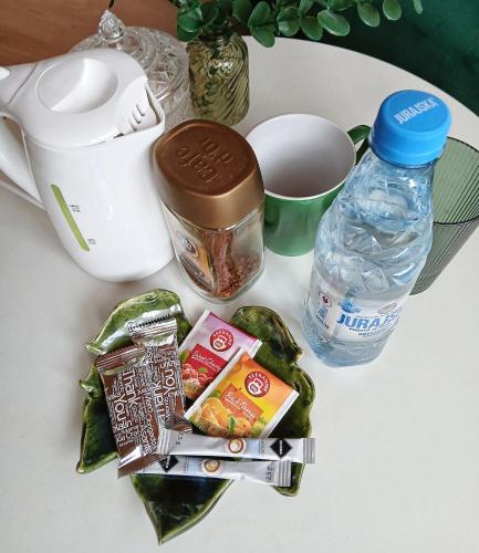a table with some food and a bottle of water at KRK stop near airport in Cholerzyn