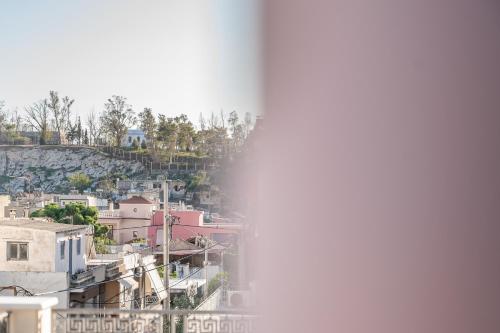 a view of a city from the top of a building at eleVSis 1 in Elefsina