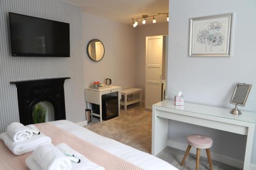Postel nebo postele na pokoji v ubytování Bridgeside Rooms