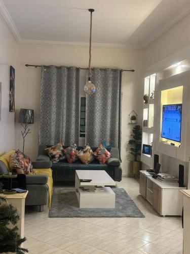 TV a/nebo společenská místnost v ubytování Appartement cosy World Rabat