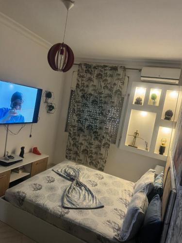 Postel nebo postele na pokoji v ubytování Appartement cosy World Rabat