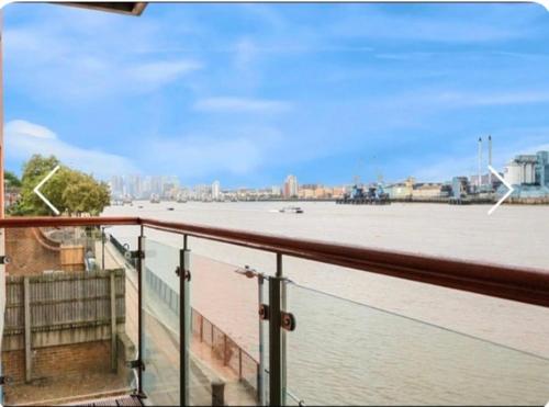 a view of a large body of water from a balcony at Amazing River view 2 bedroom apartment, sleeps 6 , balcony and parking in London