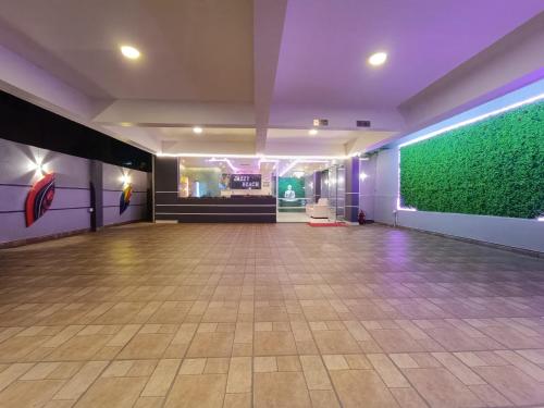 a empty dance floor with a green wall at Jazzy Beach Guest House in Visakhapatnam