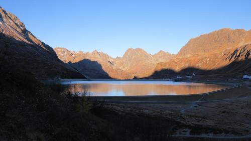 a lake in the middle of a mountain range at 4two in Galtür