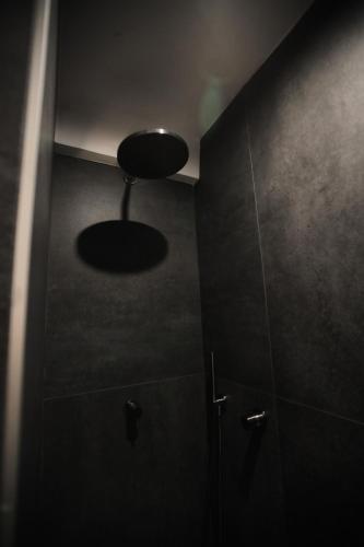 a bathroom with a shower with a round ceiling at Chez Liart 2 in Fasano